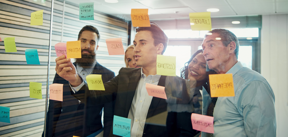 Business people brainstorming with sticky notes